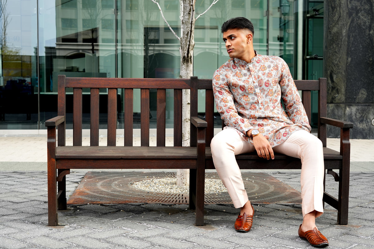 Floral kurta styled outdoors on a park bench.